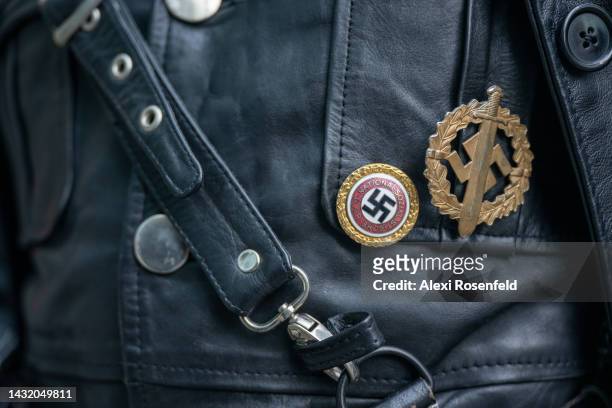 Close up of Nazi swastikas on a person's costume dressed as Cronin from "Hellboy" during New York Comic Con 2022 on October 09, 2022 in New York...