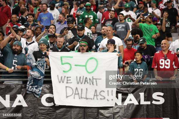 Philadelphia Eagles fan holds up a sign after the Eagles' 20-17 win against the Arizona Cardinals at State Farm Stadium on October 09, 2022 in...