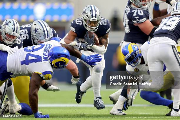 Tony Pollard of the Dallas Cowboys runs against the Los Angeles Rams during the fourth quarter at SoFi Stadium on October 09, 2022 in Inglewood,...