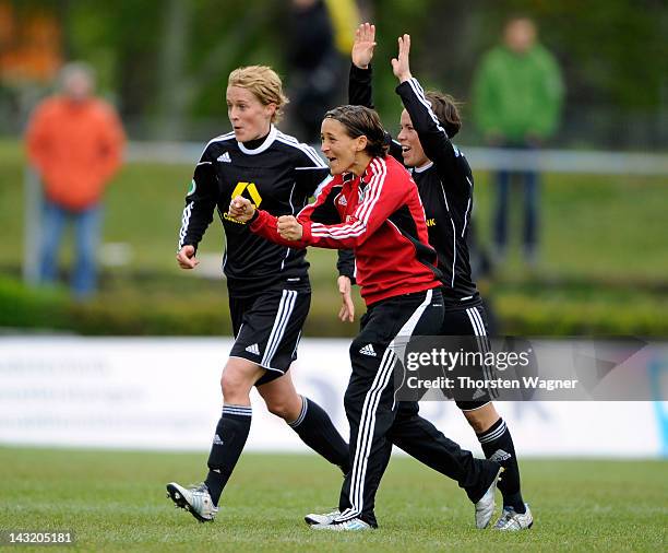 Saskia Bartusiak, Sandra Smisek and Meike Weber celebrates after winning the UEFA Women's Champions League Semi Final match between 1.FFC Frankfurt...