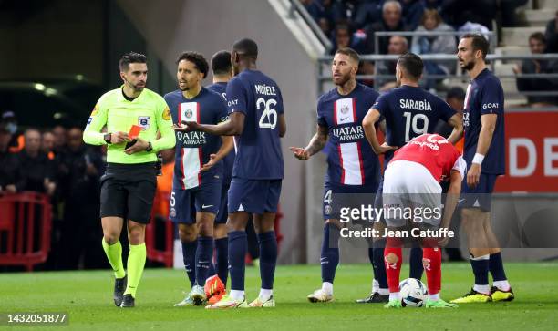 Referee Pierre Gaillouste gives a red card to Sergio Ramos of PSG during the Ligue 1 match between Stade de Reims and Paris Saint-Germain at Stade...