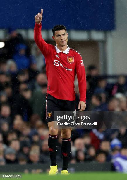 Cristiano Ronaldo of Manchester United celebrates to the fans after scoring his teams second goal during the Premier League match between Everton FC...
