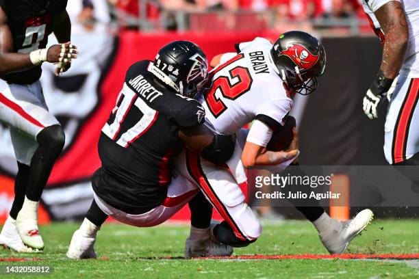Grady Jarrett of the Atlanta Falcons sacks Tom Brady of the Tampa Bay Buccaneers during the fourth quarter of the game at Raymond James Stadium on...