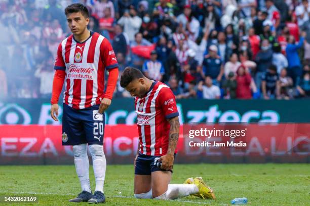 Fernando Beltran and Alexis Vega of Chivas react after the playoff match between Puebla and Chivas as part of the Torneo Apertura 2022 Liga MX at...