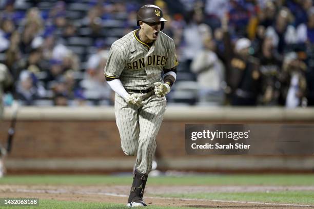 Manny Machado of the San Diego Padres celebrates after hitting an RBI single to score Jurickson Profar against the New York Mets during the fifth...