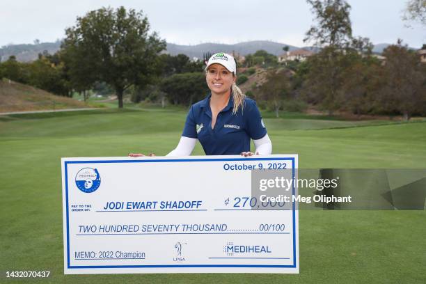 Jodi Ewart Shadoff of England poses with the check on the 18th green after winning the LPGA MEDIHEAL Championship at The Saticoy Club on October 09,...