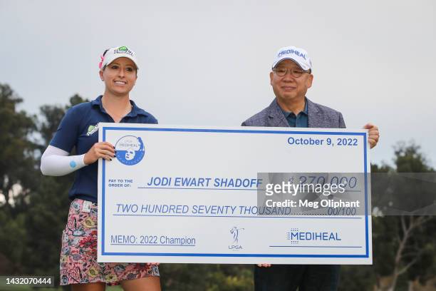 Jodi Ewart Shadoff of England is presented with the check by Chairman of MEDIHEAL Oh Sub Kwon after winning the LPGA MEDIHEAL Championship at The...