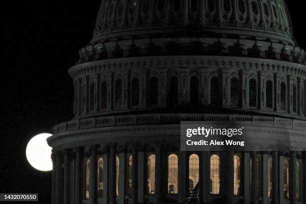 The Hunter’s Moon rises behind the dome of the U.S. Capitol on October 9, 2022 in Washington, DC. The Hunter’s Moon historically signaled the time...