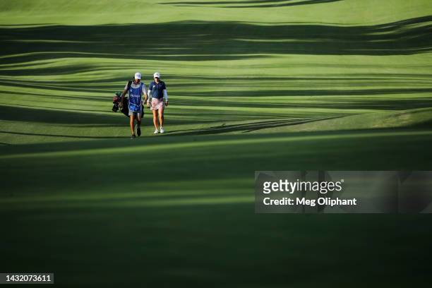 Jodi Ewart Shadoff of England walks down the 17th fairway with caddie John Pavelko during the final round of the LPGA MEDIHEAL Championship at The...