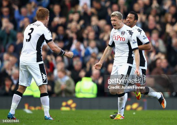 Pavel Pogrebnyak of Fulham celebrates scoring the equalising goal with team mates John Arne Riise and Moussa Dembele during the Barclays Premier...