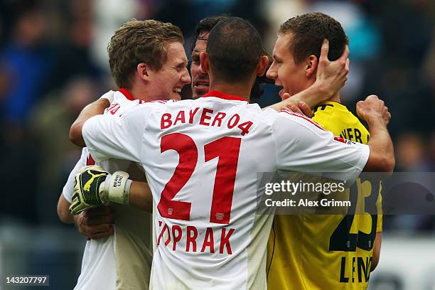 Andre Schuerrle, Manuel Friedrich, Oemer Toprak and goalkeeper Bernd Leno of Leverkusen celebrate after the Bundesliga match between 1899 Hoffenheim...