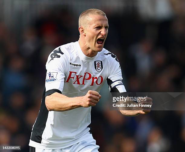 Brede Hangeland of Fulham celebrates victory in the Barclays Premier League match between Fulham and Wigan Athletic at Craven Cottage on April 21,...