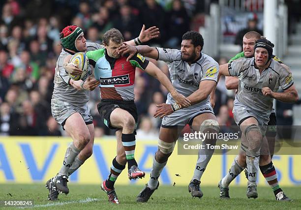 Nick Evans of Harlequins is tackled by Steve Mafi of Leicester during the Aviva Premiership match between Harlequins and Leicester Tigers at...