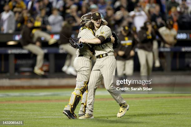 Josh Hader of the San Diego Padres celebrates with Austin Nola after defeating the New York Mets in game three to win the National League Wild Card...