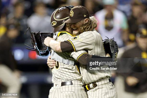 Josh Hader of the San Diego Padres celebrates with Austin Nola after defeating the New York Mets in game three to win the National League Wild Card...