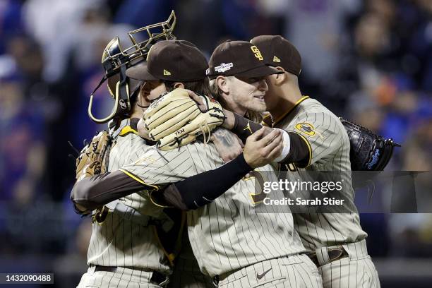 Josh Hader of the San Diego Padres celebrates with Austin Nola, Wil Myers and and Manny Machado after defeating the New York Mets in game three to...