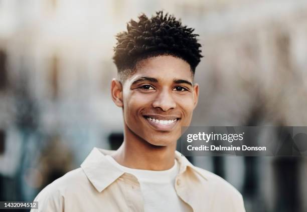 face of young black man, urban fashion and happy guy in city with blurred background. portrait of healthy african american male, modern haircut with cool style and smile with confidence in town relax - male model stock pictures, royalty-free photos & images