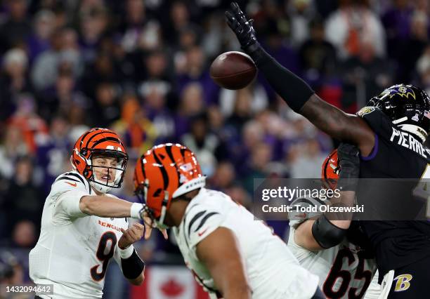 Jason Pierre-Paul of the Baltimore Ravens knocks this pass down by Joe Burrow of the Cincinnati Bengals during the second quarter at M&T Bank Stadium...