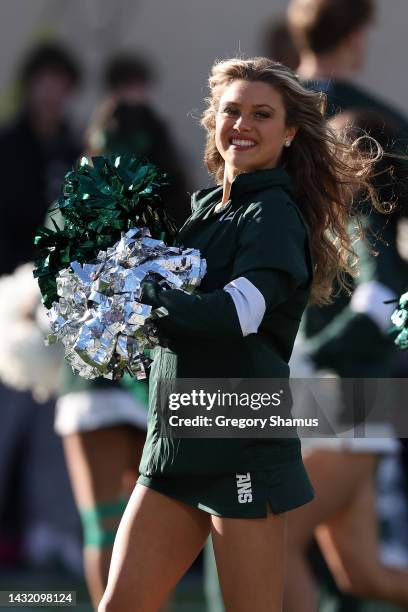 Member of the Michigan State Spartans dance team performs during a game against the Ohio State Buckeyes at Spartan Stadium on October 08, 2022 in...