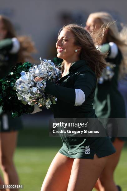 Member of the Michigan State Spartans dance team performs during a game against the Ohio State Buckeyes at Spartan Stadium on October 08, 2022 in...