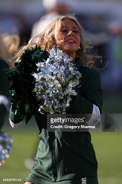 Member of the Michigan State Spartans dance team performs during a game against the Ohio State Buckeyes at Spartan Stadium on October 08, 2022 in...
