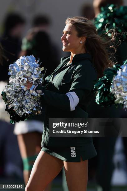 Member of the Michigan State Spartans dance team performs during a game against the Ohio State Buckeyes at Spartan Stadium on October 08, 2022 in...