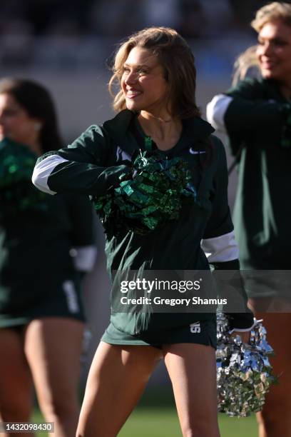 Member of the Michigan State Spartans dance team performs during a game against the Ohio State Buckeyes at Spartan Stadium on October 08, 2022 in...