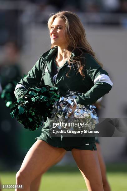 Member of the Michigan State Spartans dance team performs during a game against the Ohio State Buckeyes at Spartan Stadium on October 08, 2022 in...