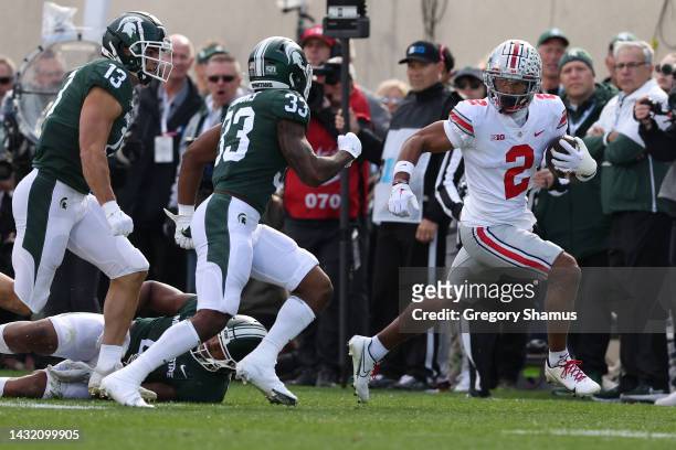 Emeka Egbuka of the Ohio State Buckeyes plays against the Michigan State Spartansat Spartan Stadium on October 08, 2022 in East Lansing, Michigan.