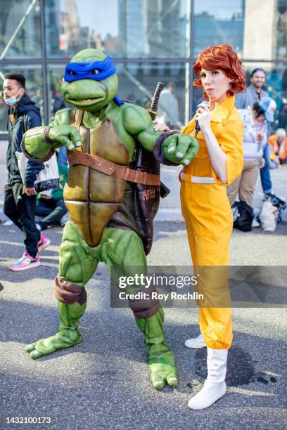 Leonardo and April O'Neil cosplayers from "Teenage Mutant Ninja Turtles" pose during New York Comic Con 2022 on October 09, 2022 in New York City.