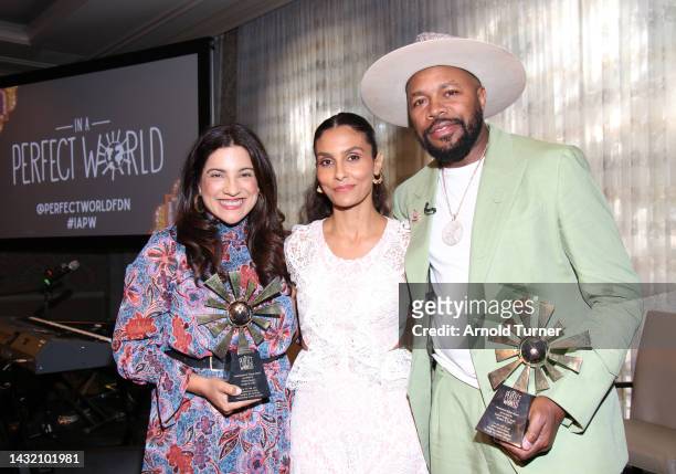 Reshma Saujani, Manuela Testolini and D-Nice pose onstage with their awards during In a Perfect World's 2022 A World of Good Luncheon at Four Seasons...
