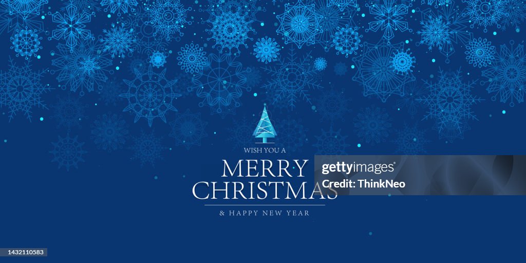 Christmas blue background design of falling snowflake