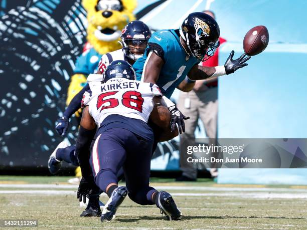 Linebacker Christian Kirksey of the Houston Texans makes a tackle againt Runningback Travis Etienne of the Jacksonville Jaguars which caused him to...