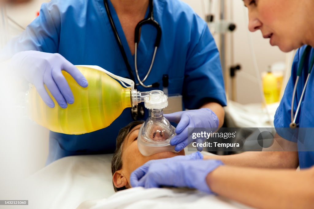 Bagging Mask Medical Personnel Are Carefully Bagging A Patient Ie Providing Positive ...