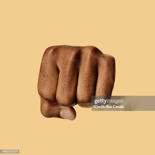 fist - raised fist stock pictures, royalty-free photos & images