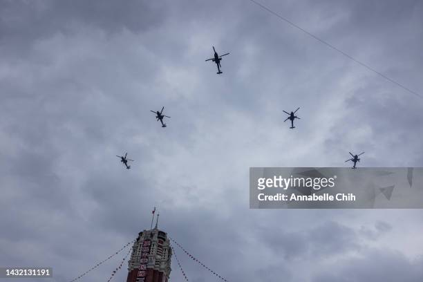 Five military helicopters fly by Taipei on the Taiwan's National Day on October 10, 2022 in Taipei, Taiwan. Taiwan playing a significant role in...