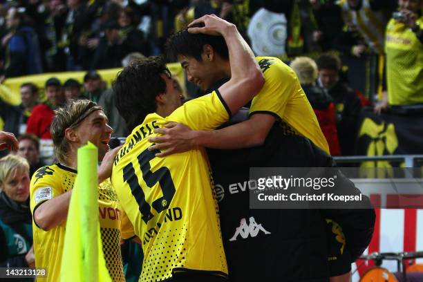 Marcel Schmelzer, Mats Hummels, head coach Juergen Klopp and Shinji Kagawa of Dortmund celebrate the second goal during the 1. Bundesliga match...