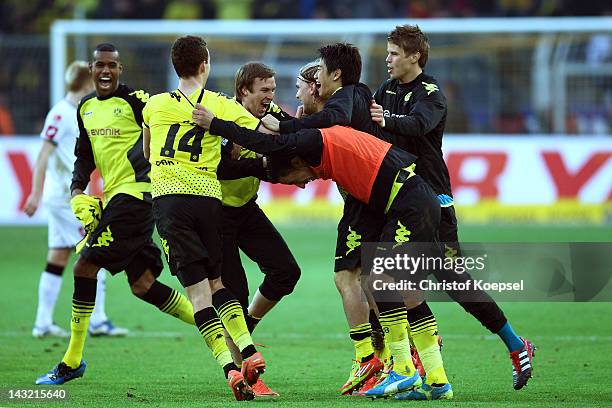 Felipe Santana, Ivan Perisic, Kevin Grosskreutz, Marcel Schmelzer, Shinji Kagawa and Moritz Leitner of Dortmund celebrate winning 2-1 and the German...