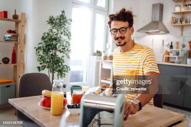 347 Guy Using Toaster Stock Photos, High-Res Pictures, and Images ...