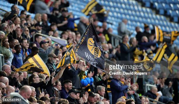Wasps fans wave their flags during the Gallagher Premiership Rugby match between Wasps and Northampton Saints at The Coventry Building Society Arena...