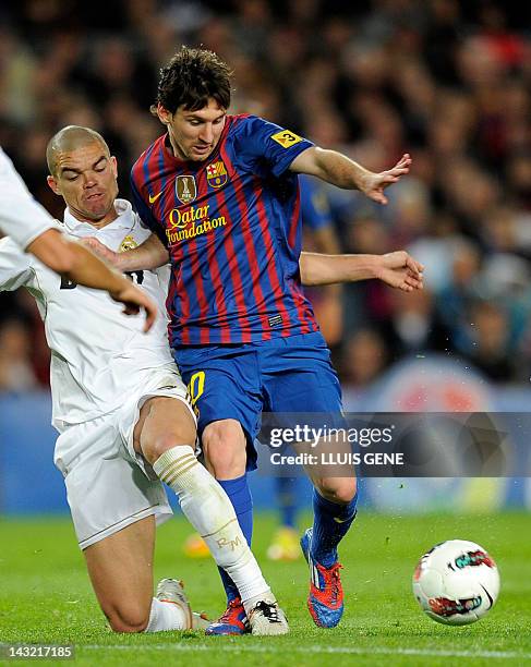 Barcelona's Argentinian forward Lionel Messi vies with Real Madrid's Portuguese defender Pepe during the Spanish League "El clasico" football match...