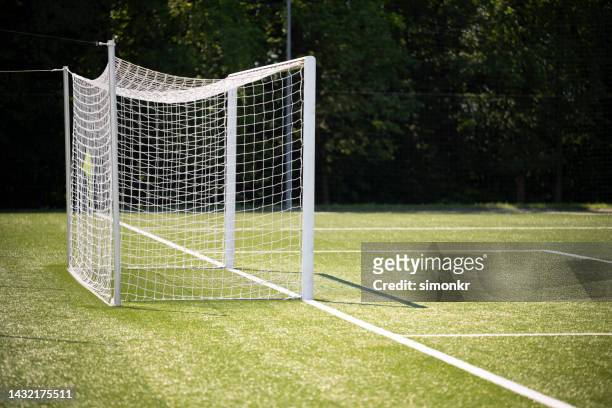 football goal post on field - goal posts stockfoto's en -beelden