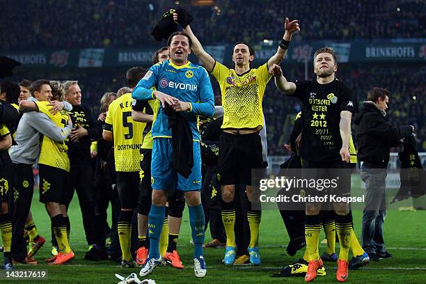 Roman Weidenfeller, Neven Subotic and Jakub Blaszczykowski of Dortmund celebrate winning the German Championships after winning 2-1 during the 1....