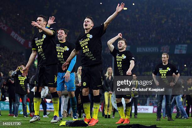 Sebastian Kehl, Roman Weidenfeller,Lukasz Piszczek and Jakub Blaszczykowski of Dortmund celebrate winning the German Championships after winning 2-0...