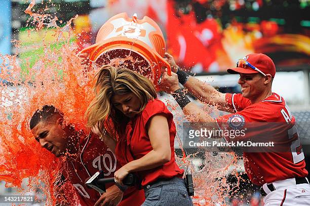 Ian Desmond of the Washington Nationals is doused with Gatorade by his teammates after hitting the game winning sacrifice fly to center in the bottom...
