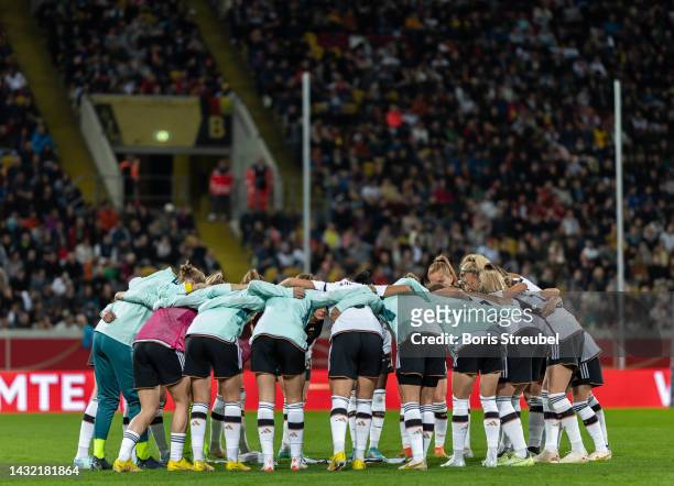 Team Germany stand in a circle prior to the international friendly match between Germany Women's and France Women's at Rudolf-Harbig-Stadion on...