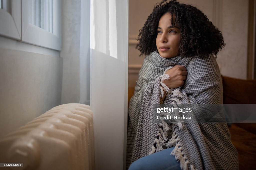 Woman feel cold in home with no heating