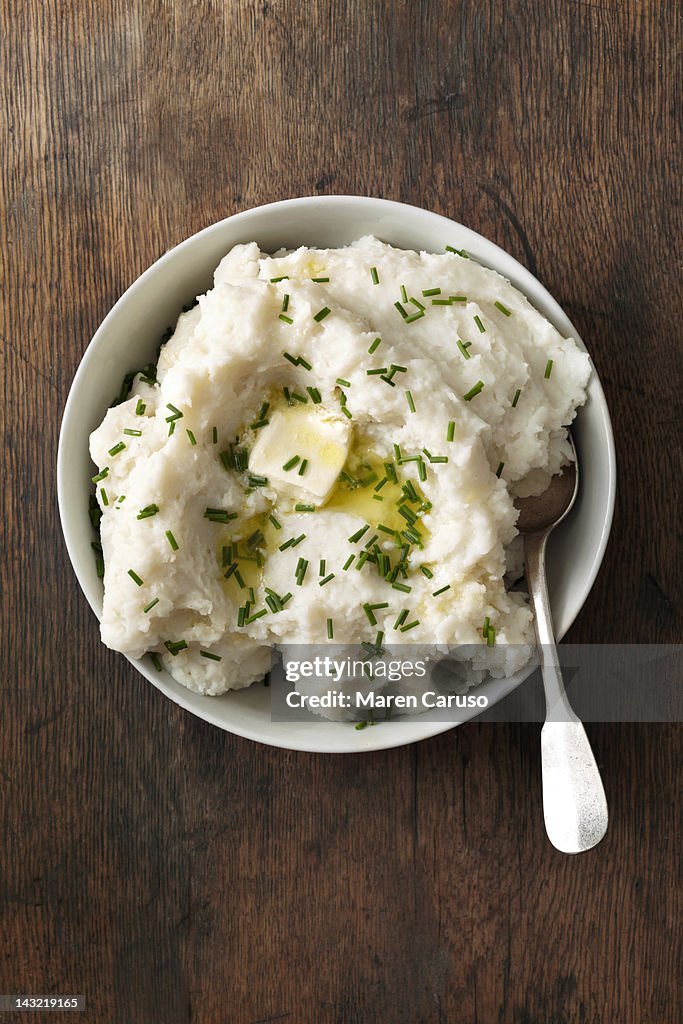 Overhead of mashed potato dish on wood surface