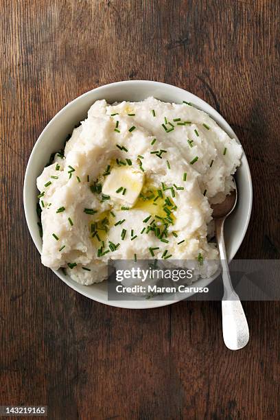 overhead of mashed potato dish on wood surface - stampen stockfoto's en -beelden