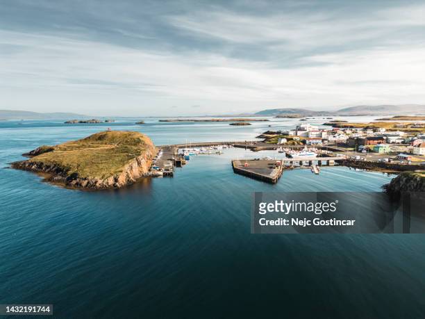 town of stykkishólmur located by the sea, including the fishing harbor - west central iceland stock pictures, royalty-free photos & images